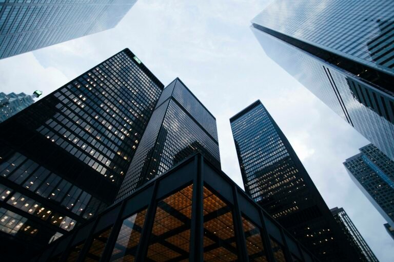 Modern glass building facade viewed from below