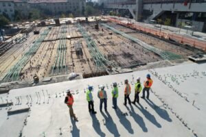 Construction workers reviewing documents on a building site
